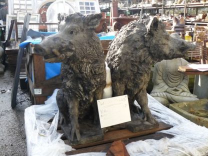 Two wild boar statues